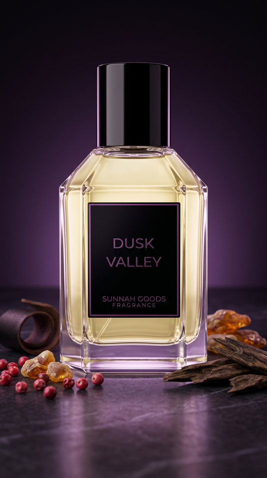 Dusk Valley EDP perfume bottle by Sunnah Goods, clear glass with black cap and purple nameplate, with oud wood, pink pepper and amber on dark marble