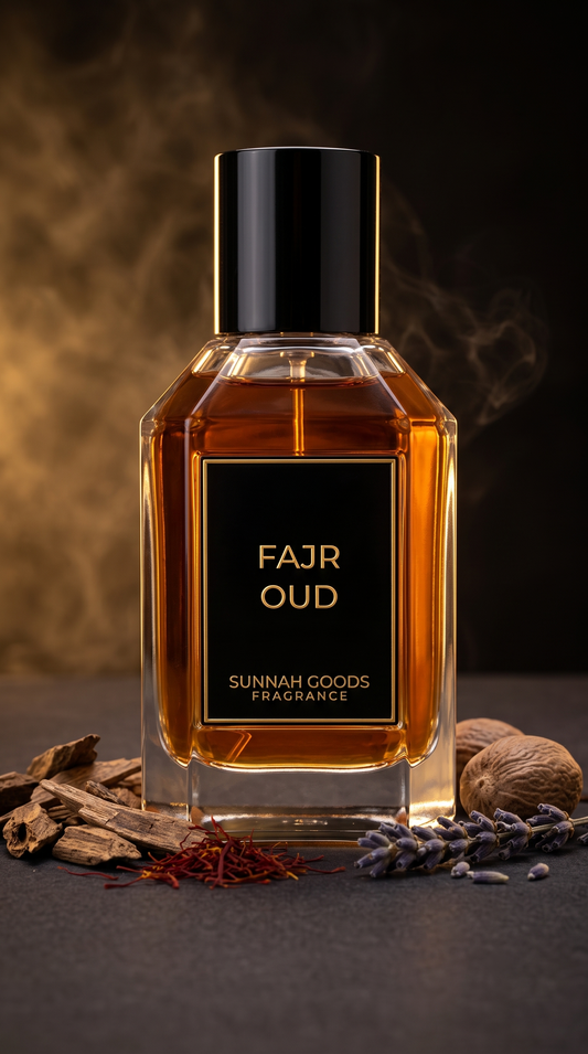 Fajr Oud EDP perfume bottle by Sunnah Goods, clear glass with black cap and gold nameplate, with oud wood, saffron and lavender on dark charcoal