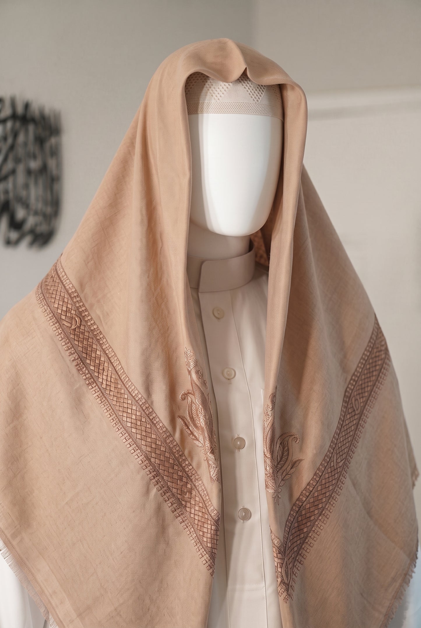 Rose Sand blush pink shemagh with silver embroidered trim on mannequin