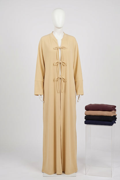 Butter yellow ribbed front tie open abaya on a mannequin