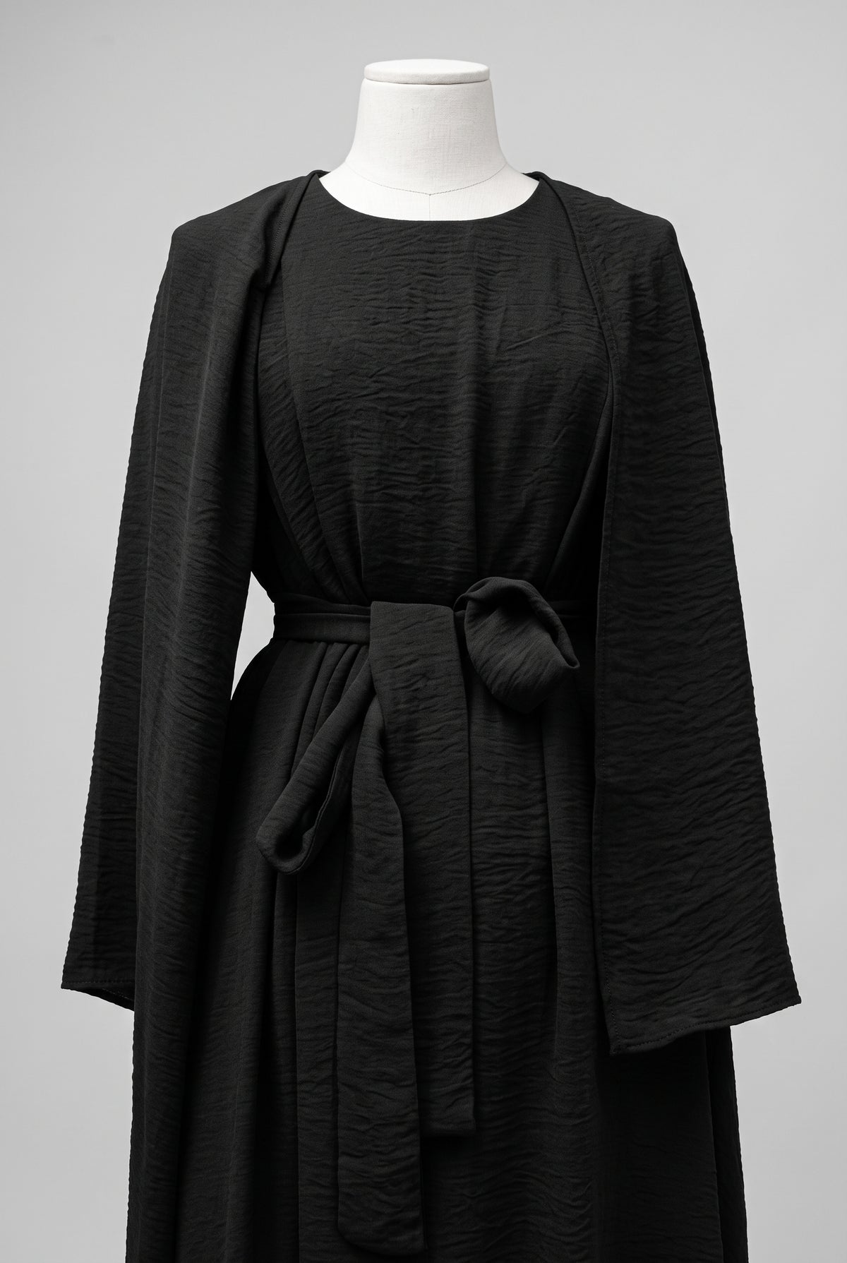 Black elegant 3-piece abaya set with belt on a dress form