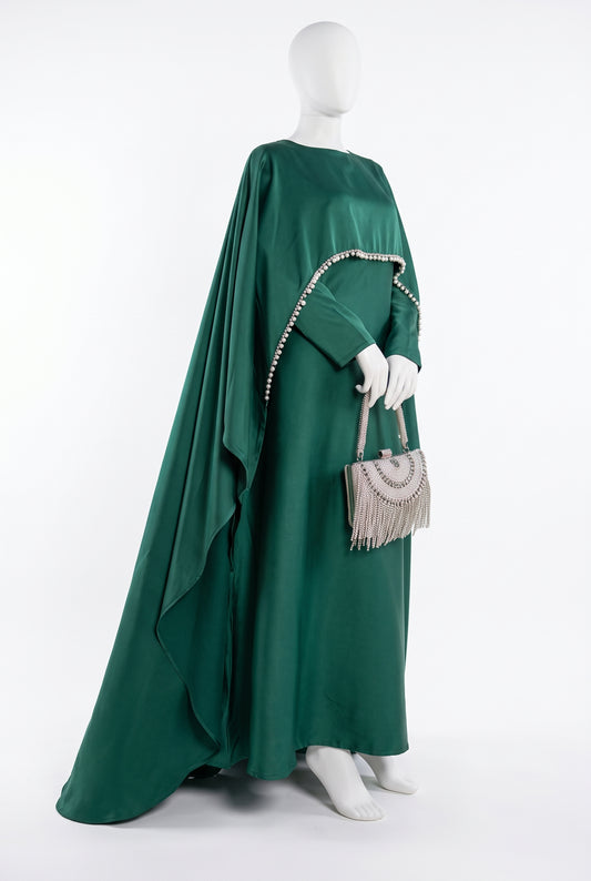 Emerald green satin 2-piece dress set with crystal beaded fringe cape on a mannequin