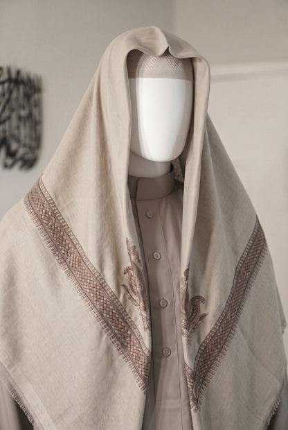Linen warm greige shemagh with embroidered detailing on mannequin
