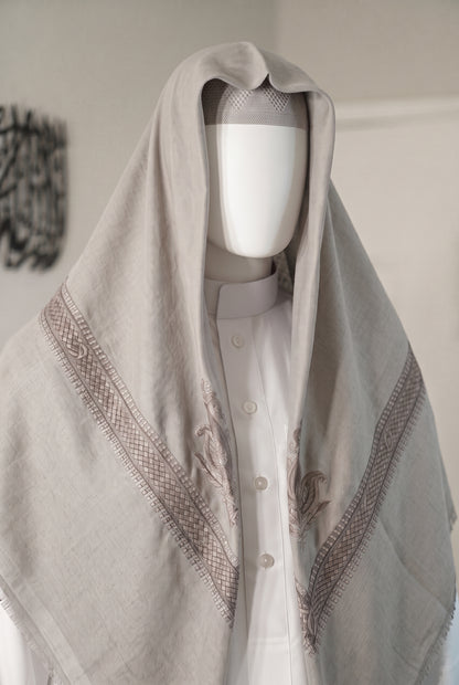 Mist soft grey shemagh with embroidered border on white mannequin