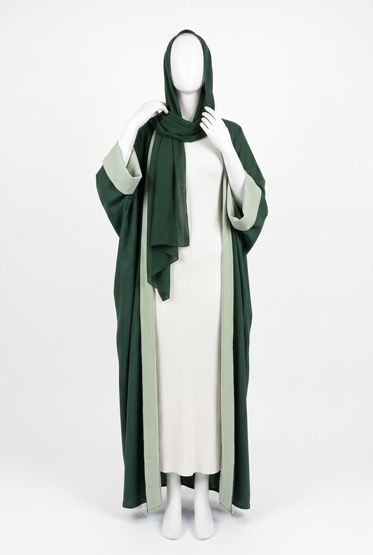 Green and white dual color open abaya dress with matching hijab on a mannequin