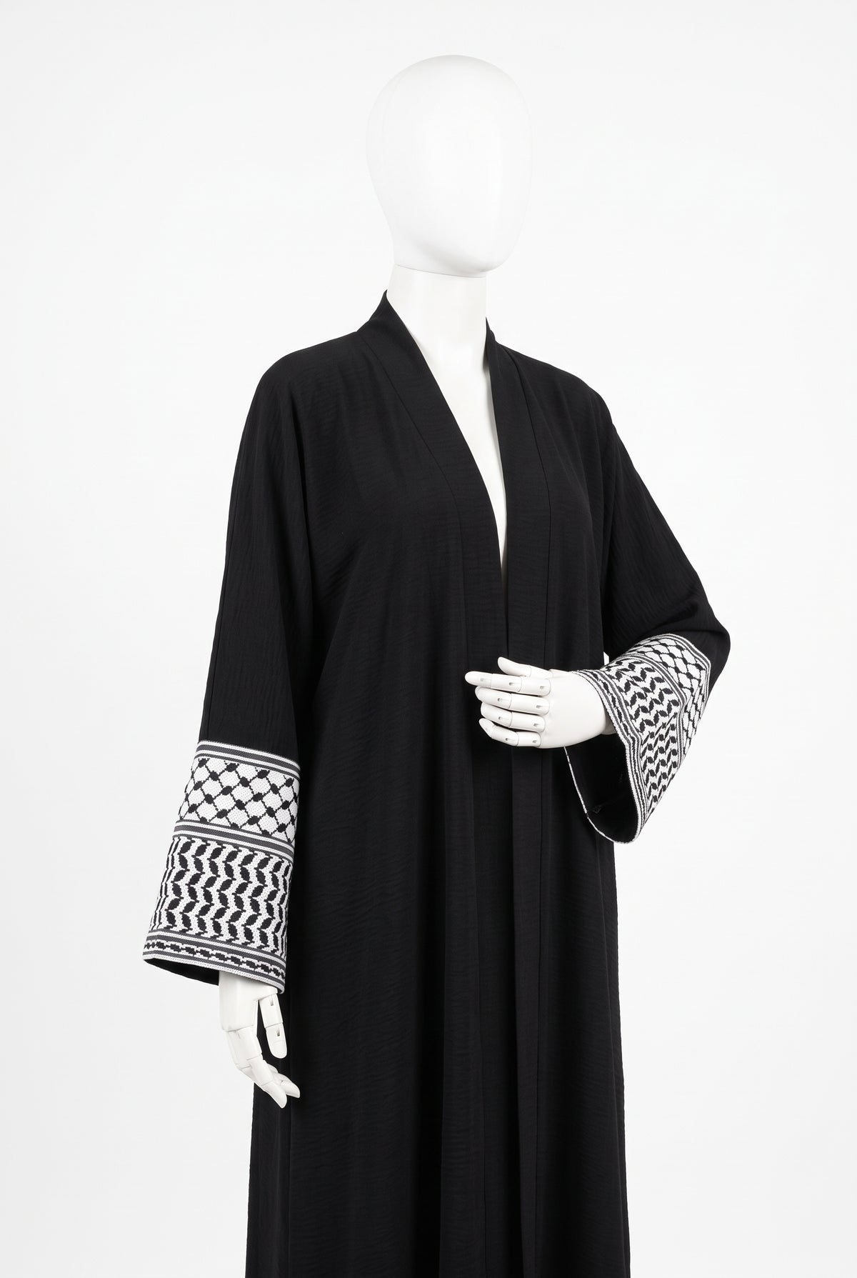 Black Palestine heritage keffiyeh cuff abaya in linen crinkle on a mannequin