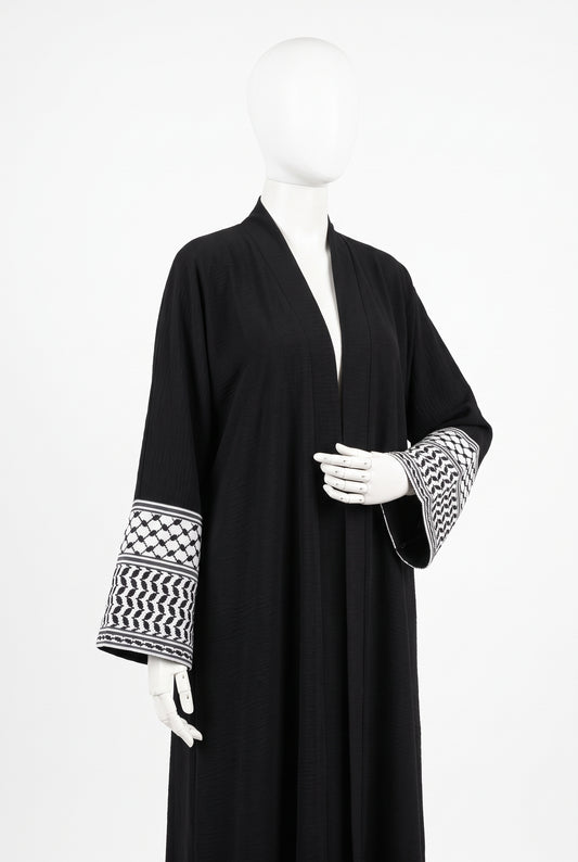 Black Palestine heritage keffiyeh cuff abaya in linen crinkle on a mannequin
