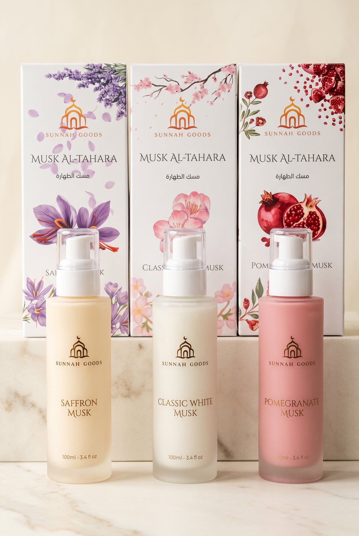 Musk Al Tahara by Sunnah Goods in Saffron Musk, Classic White Musk and Pomegranate Musk, 100ml frosted glass pump bottles in front of their gift boxes