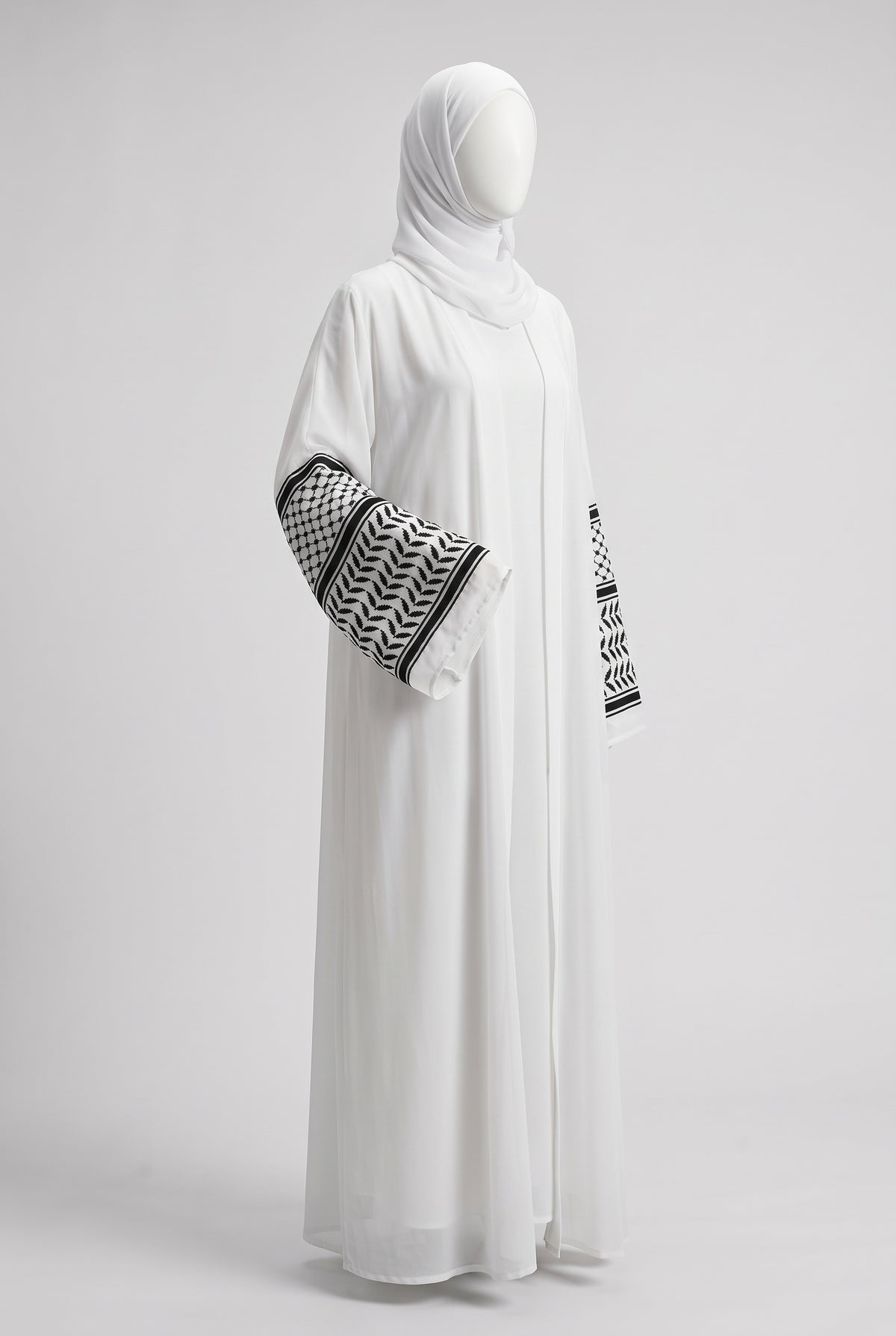 White Palestine heritage keffiyeh cuff abaya in linen crinkle on a mannequin