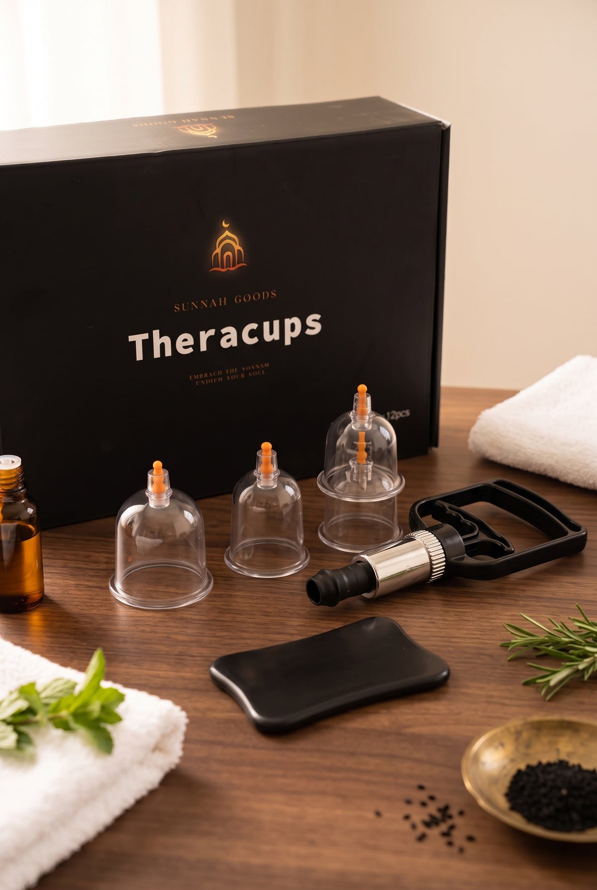 Theracups hijama cupping set with cups, pump and massage board on a wooden table with a towel and oil