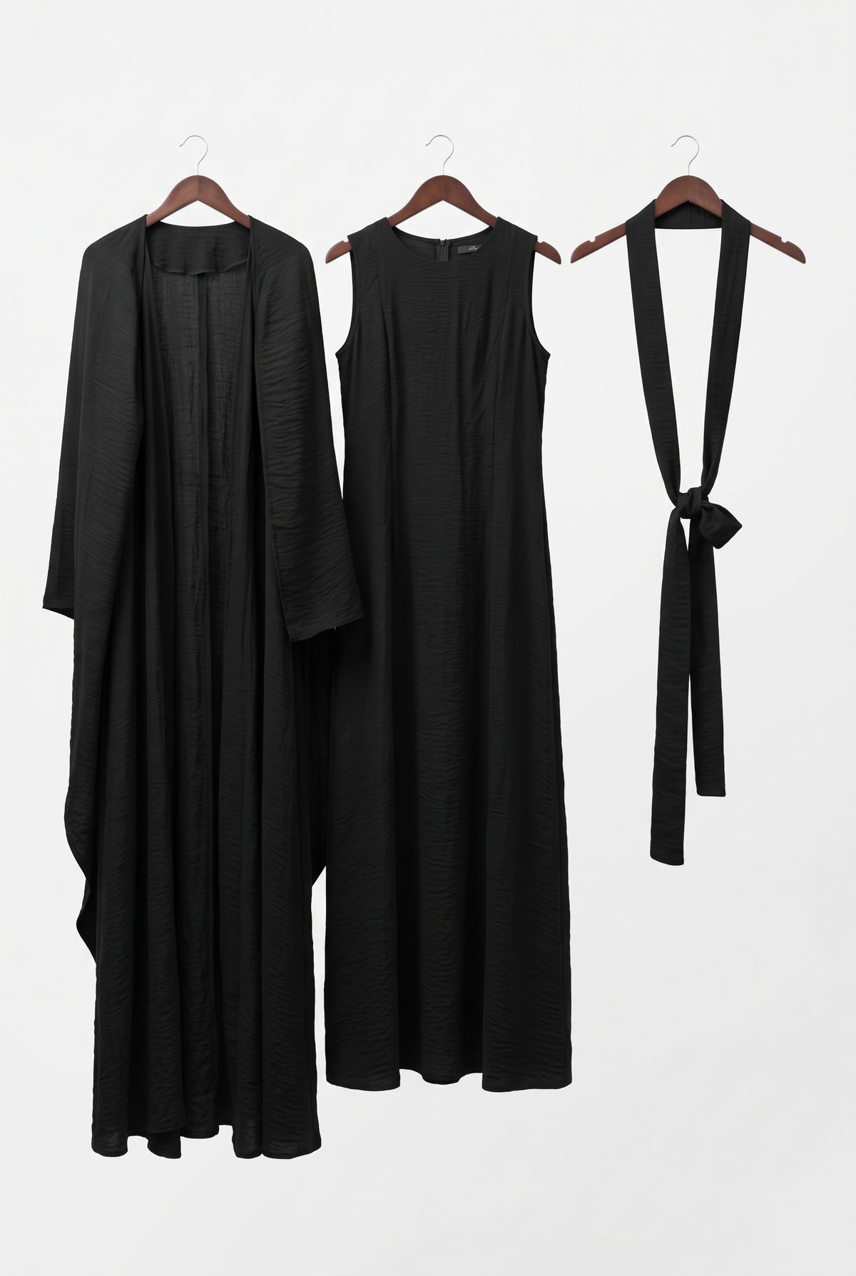 Black elegant 3-piece abaya set on hangers: open abaya, dress and belt