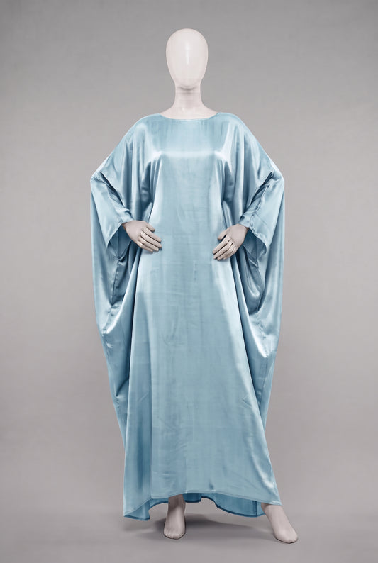 Sky blue metallic shimmer iridescent draped abaya on a mannequin