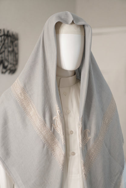 Dune silver grey shemagh with blue embroidered border on mannequin