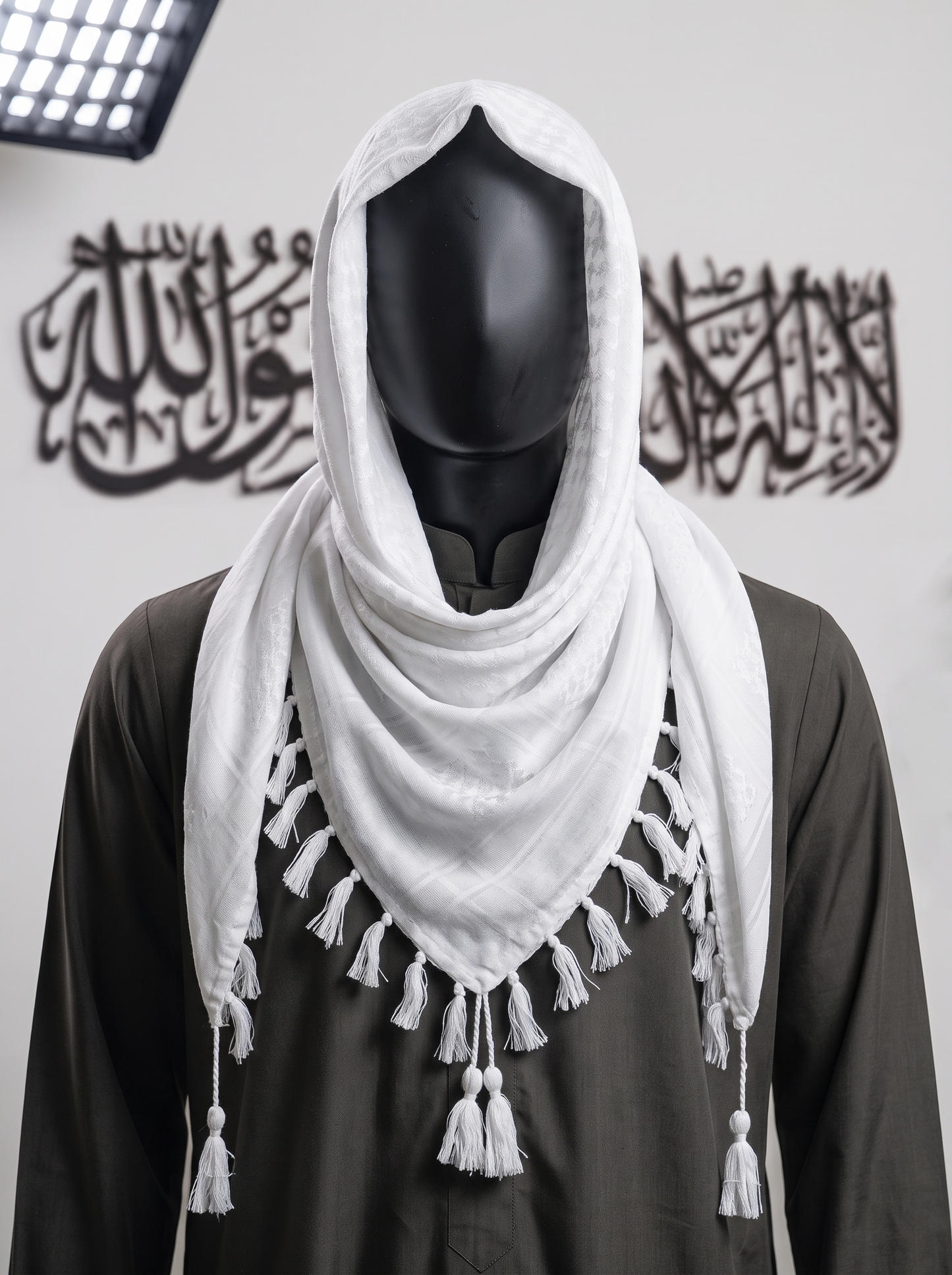 Man wearing Pearl keffiyeh, ivory and cream cotton shemagh scarf, traditional head wrap, studio portrait