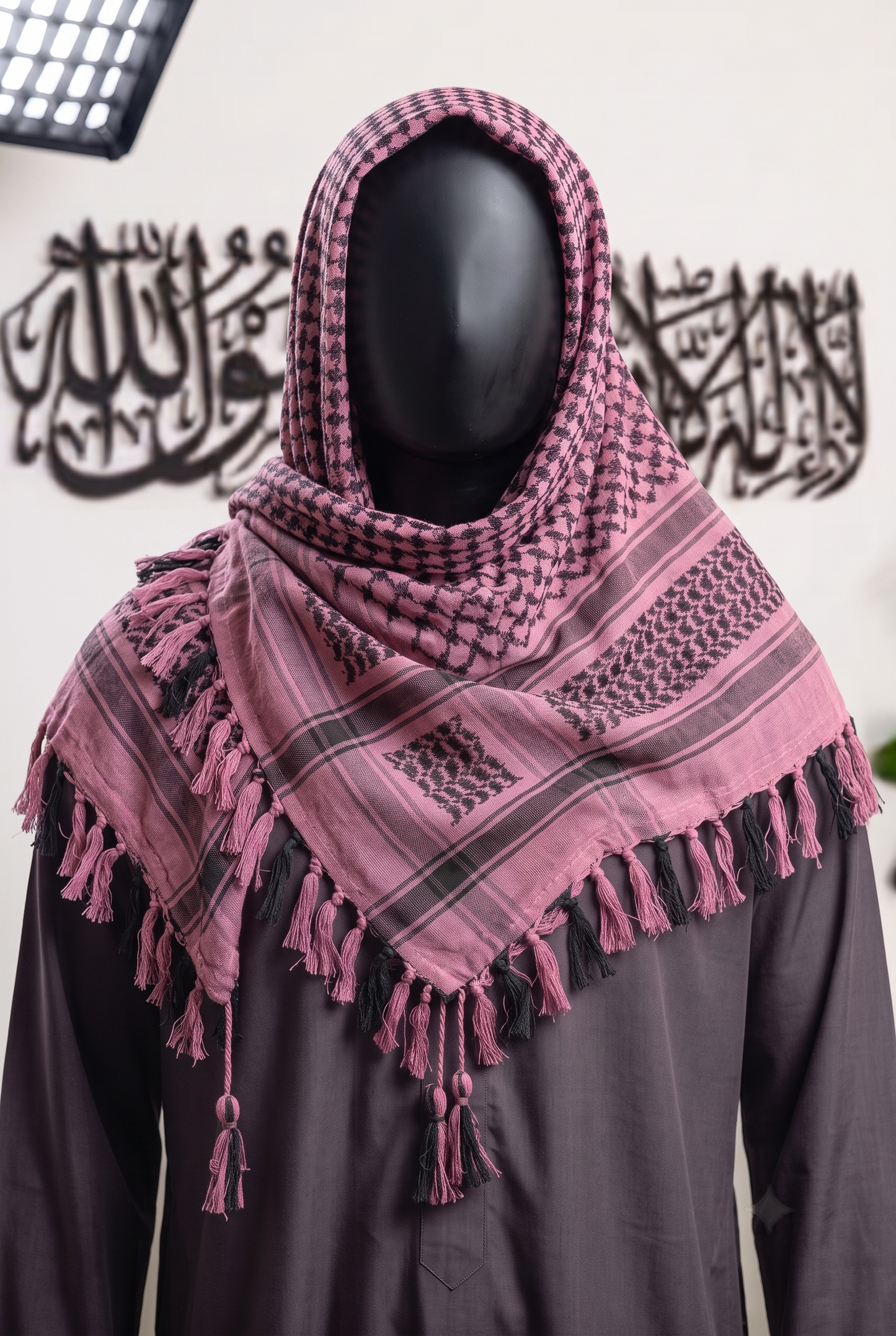 Man wearing Rosewood keffiyeh, soft pink and espresso brown cotton shemagh scarf, head wrap, studio portrait