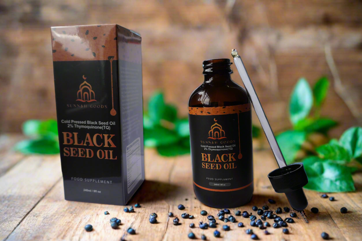 Black seed oil in a luxurious black and gold setting, with seeds scattered around