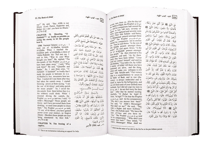 Summarized Sahih Al-Bukhari – open book showing hadith in Arabic and English