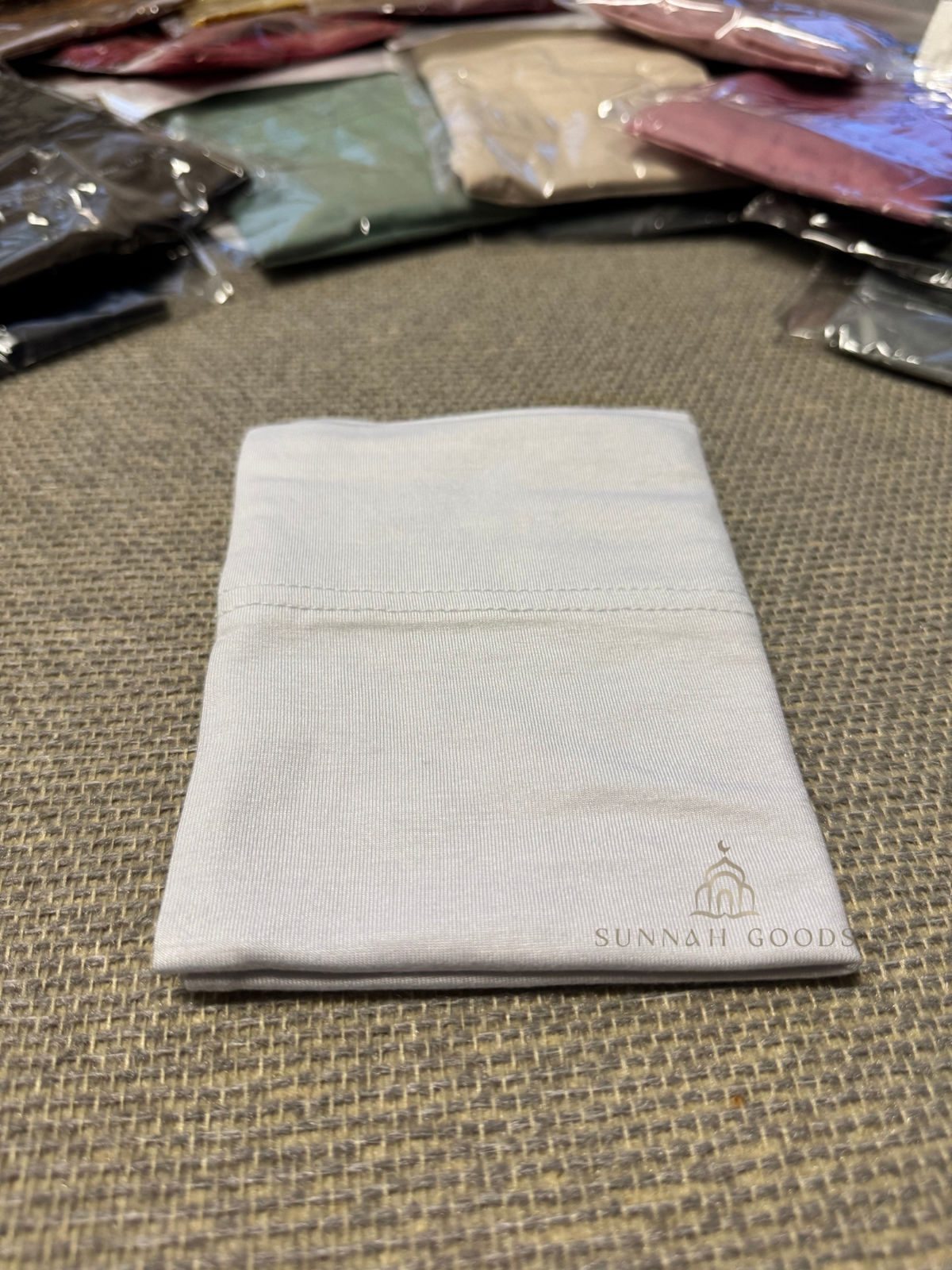 White open jersey cotton hijab underscarf, folded